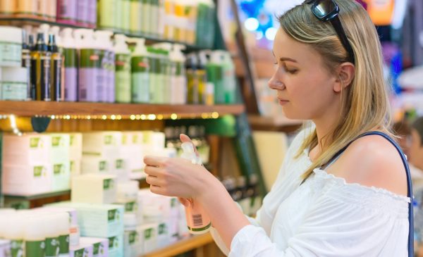 Image of woman choosing products that may contain endocrine disrupting chemicals