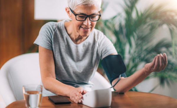 woman testing blood pressure